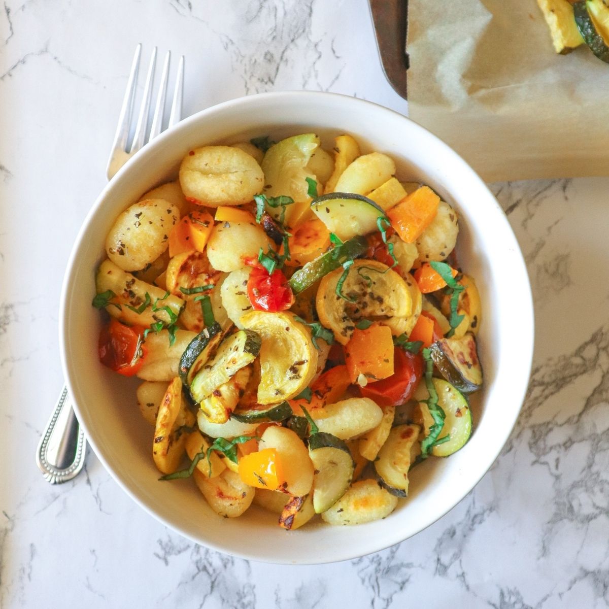 oven roasted yellow squash gnocchi in a bowl