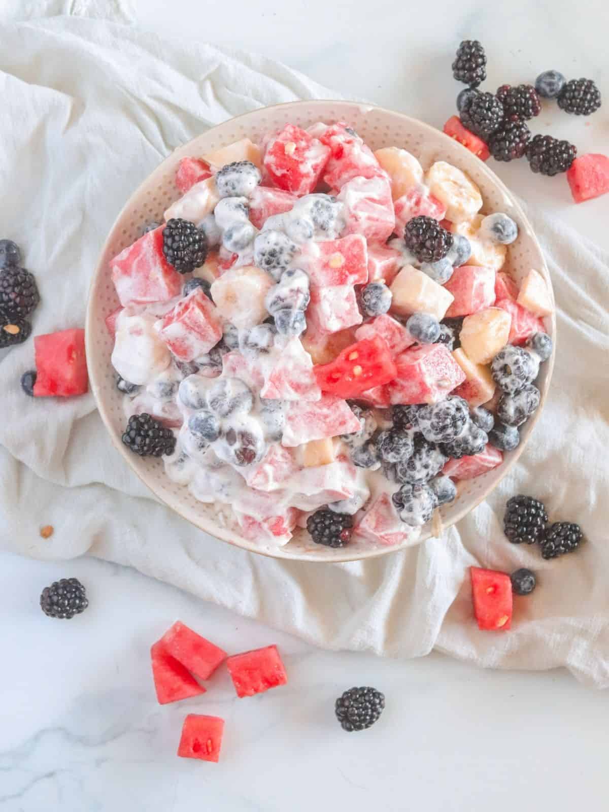 Watermelon and bananas on white surface