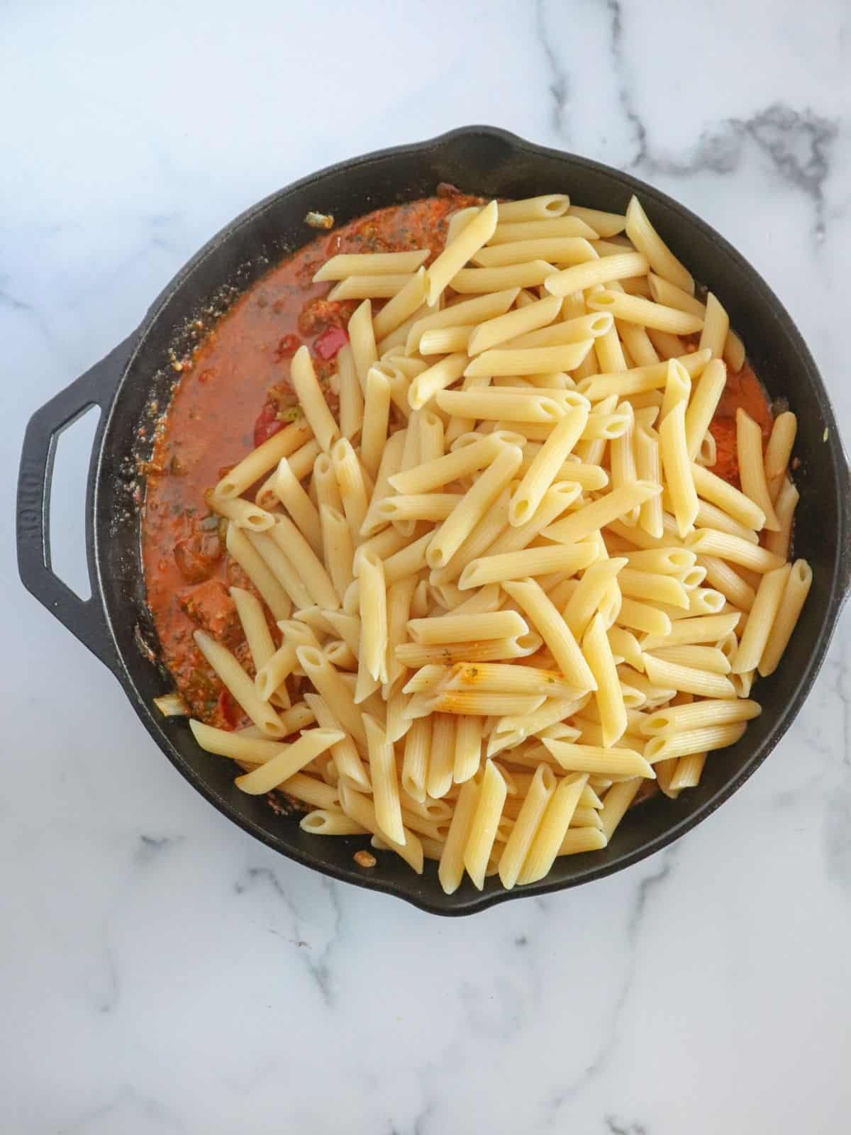 pasta and pesto in skillet