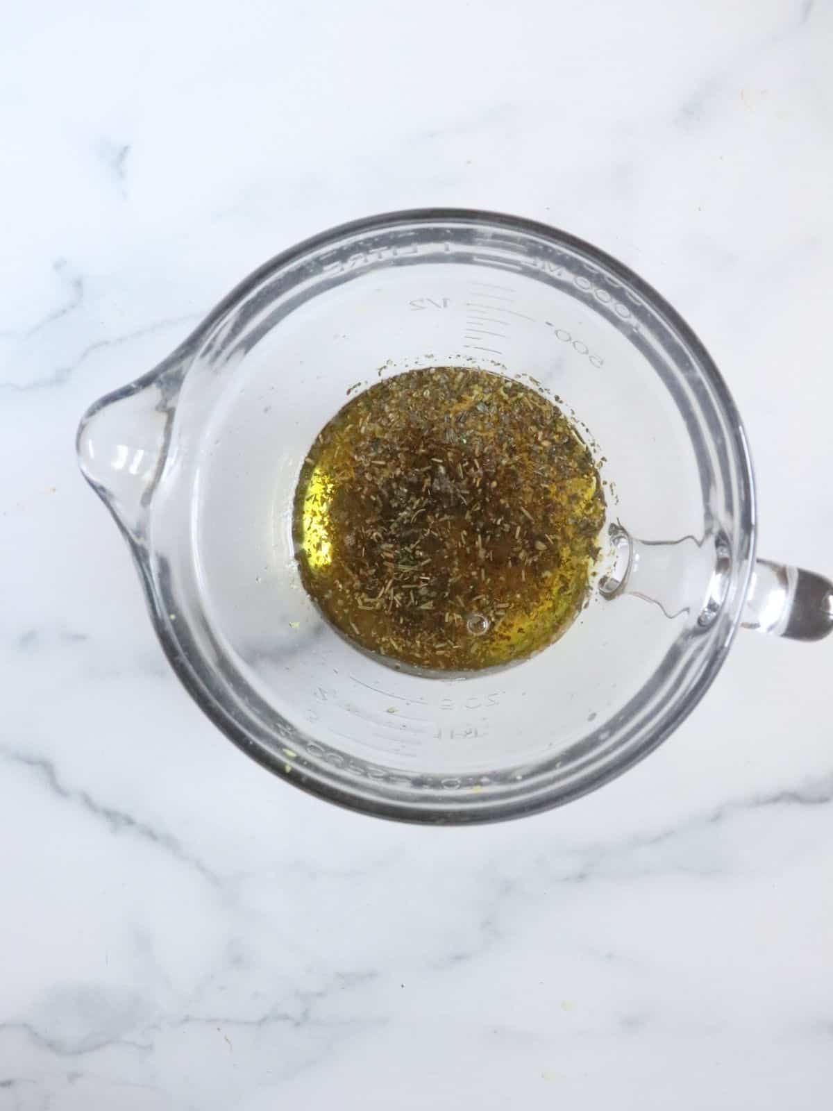 olive oil and seasonings in mixing bowl