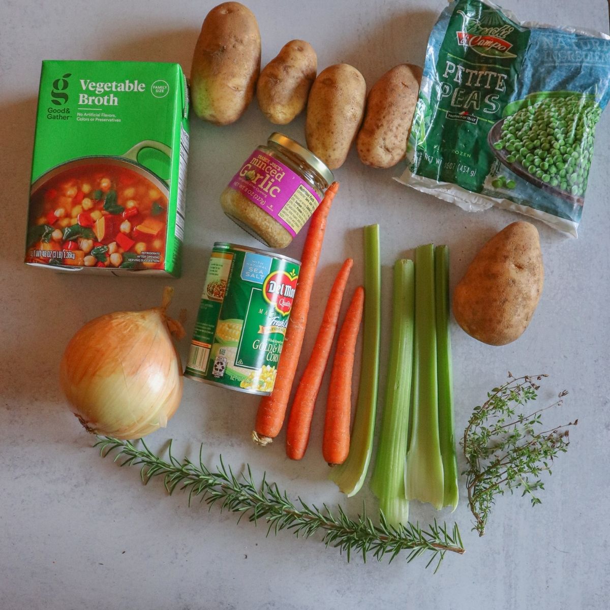Vegetable Broth, potatoes, peas, celery, carrots, garlic, corn, onion, thyme and rosemary