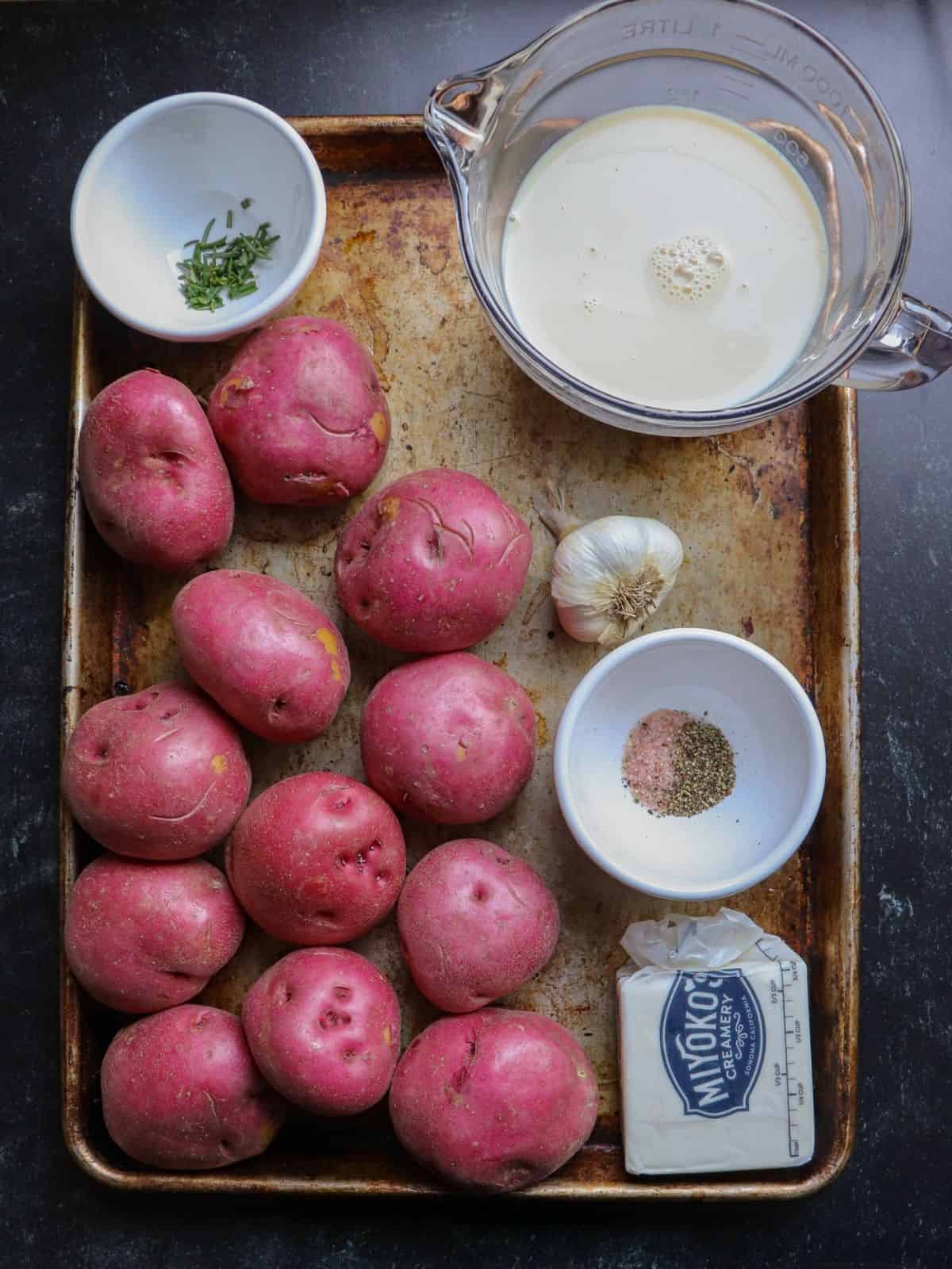 Red Potatoes, vegan butter, salt, pepper, rosemary, soy milk, garlic