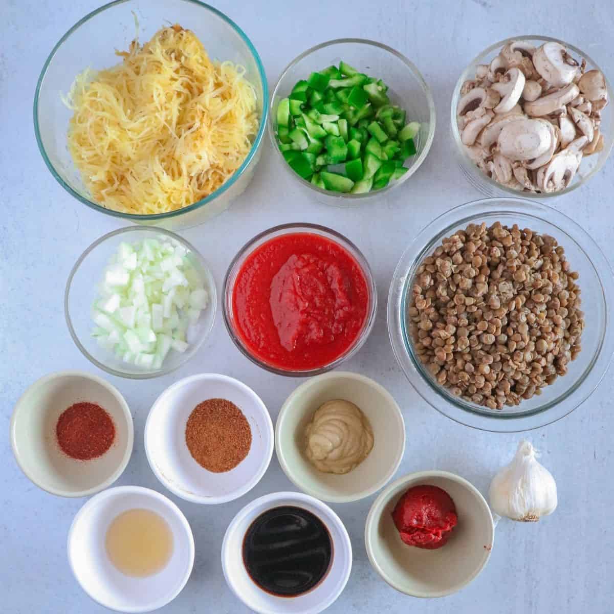 12 bowls of ingredients on white background
