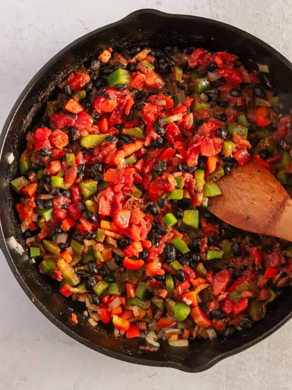 diced vegetables in cast iron skillet