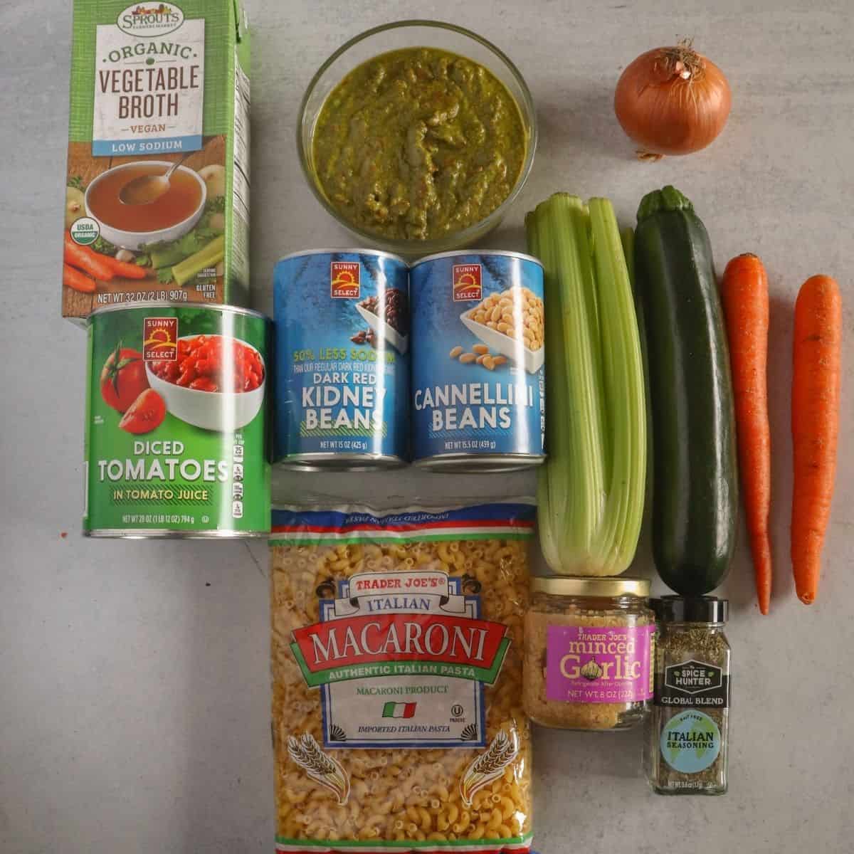 Diced tomatoes, veggie broth, pesto, onion, carrots, zucchini, celery, white beans, kidney beans, elbow noodles, garlic, italian seasoning