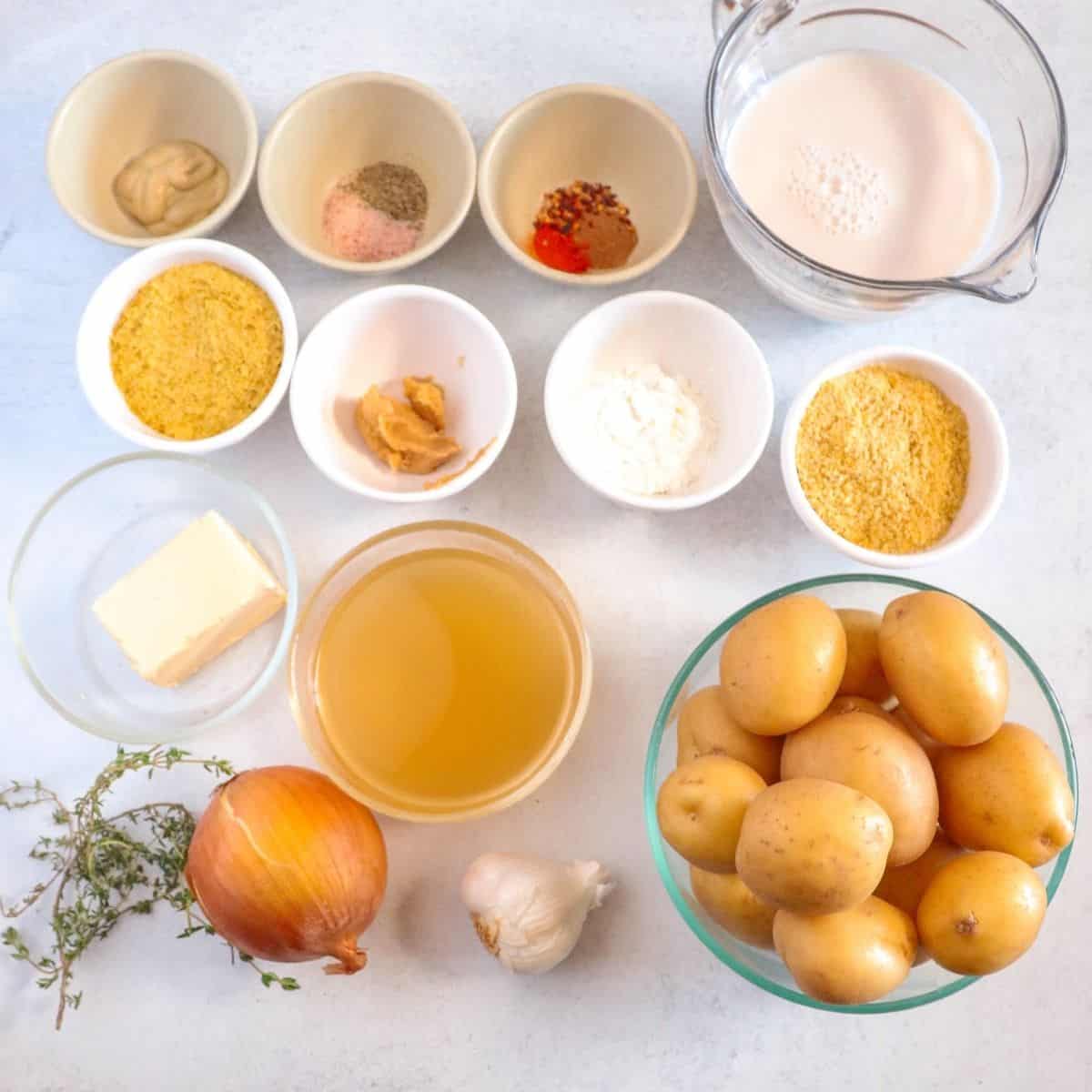 ingredients in various bowls on white surface