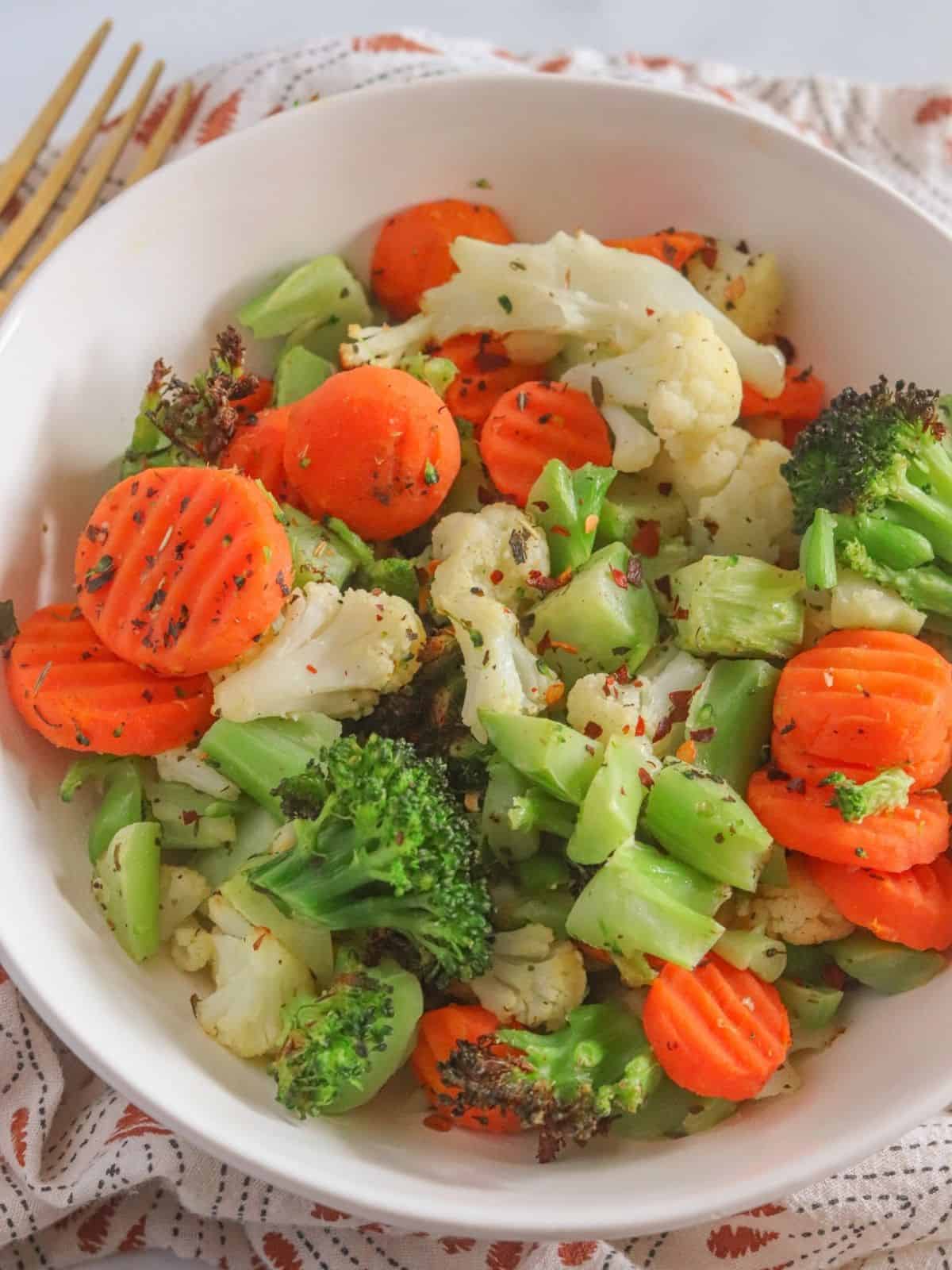 close up of broccoli and cauliflower in bowl. 