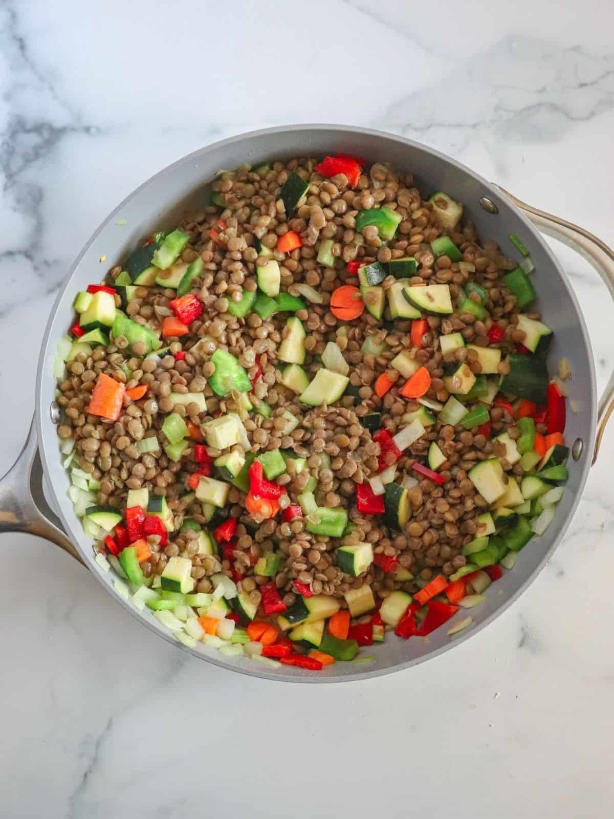 lentils and vegetables in pan