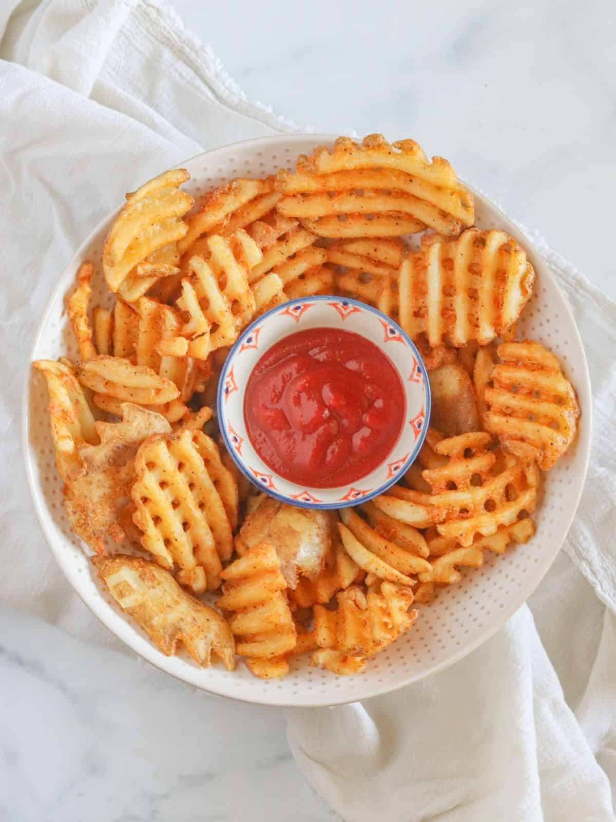 Criss cross vegetables in bowl with ketchup