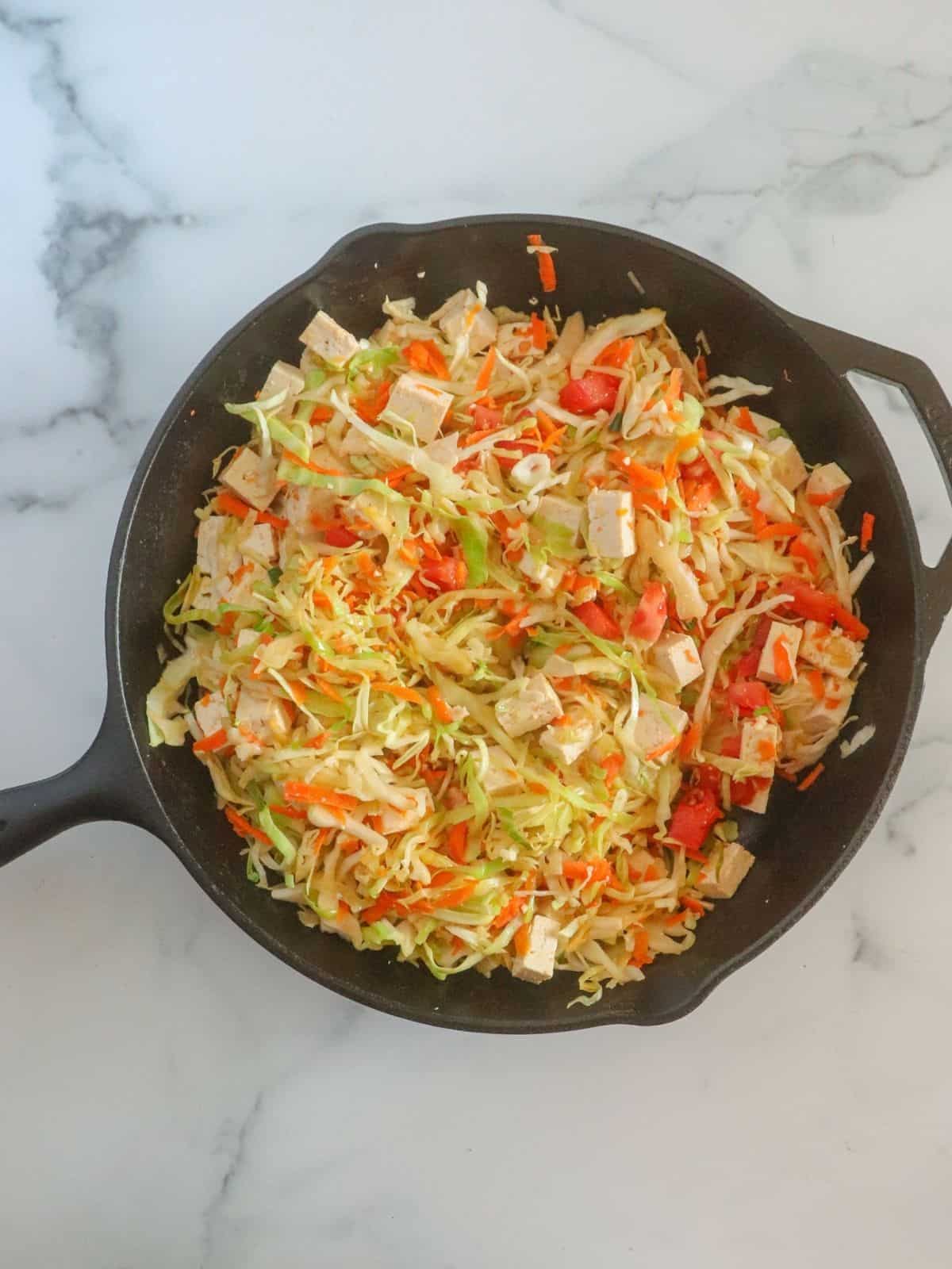 cabbage and vegetables in skillet