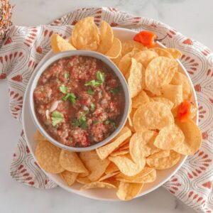 grey bowl on patterned napkin with tortilla chips