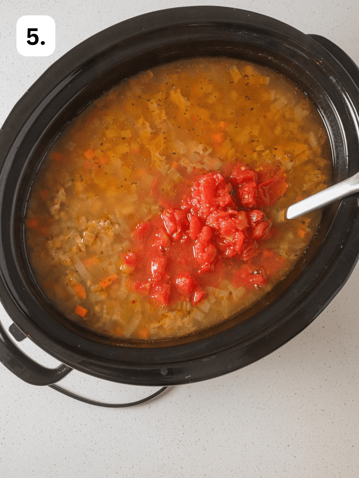 Diced tomatoes stirred in slow cooker