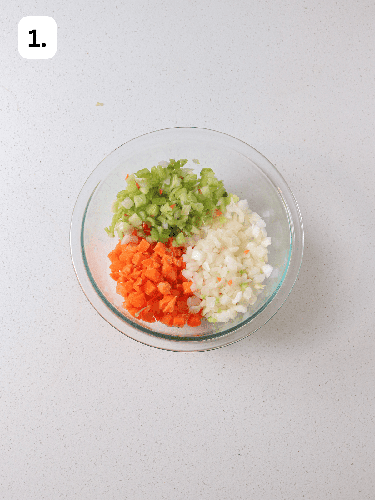 Finely diced carrots, celery and onion in bowl